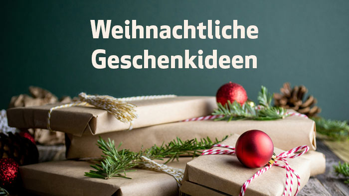 zur Themenseite Weihnachtliche Geschenkideen weiße Schrift mit Weihnachtliche Geschenkideen - im Hintergrund weihnachtliche Geschenke